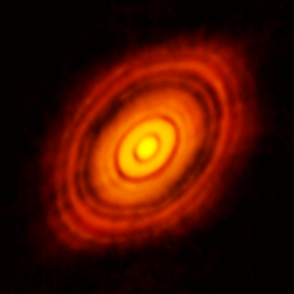 Protoplanetary disk showing rings of dust and gas around a young star, illustrating early solar system formation 